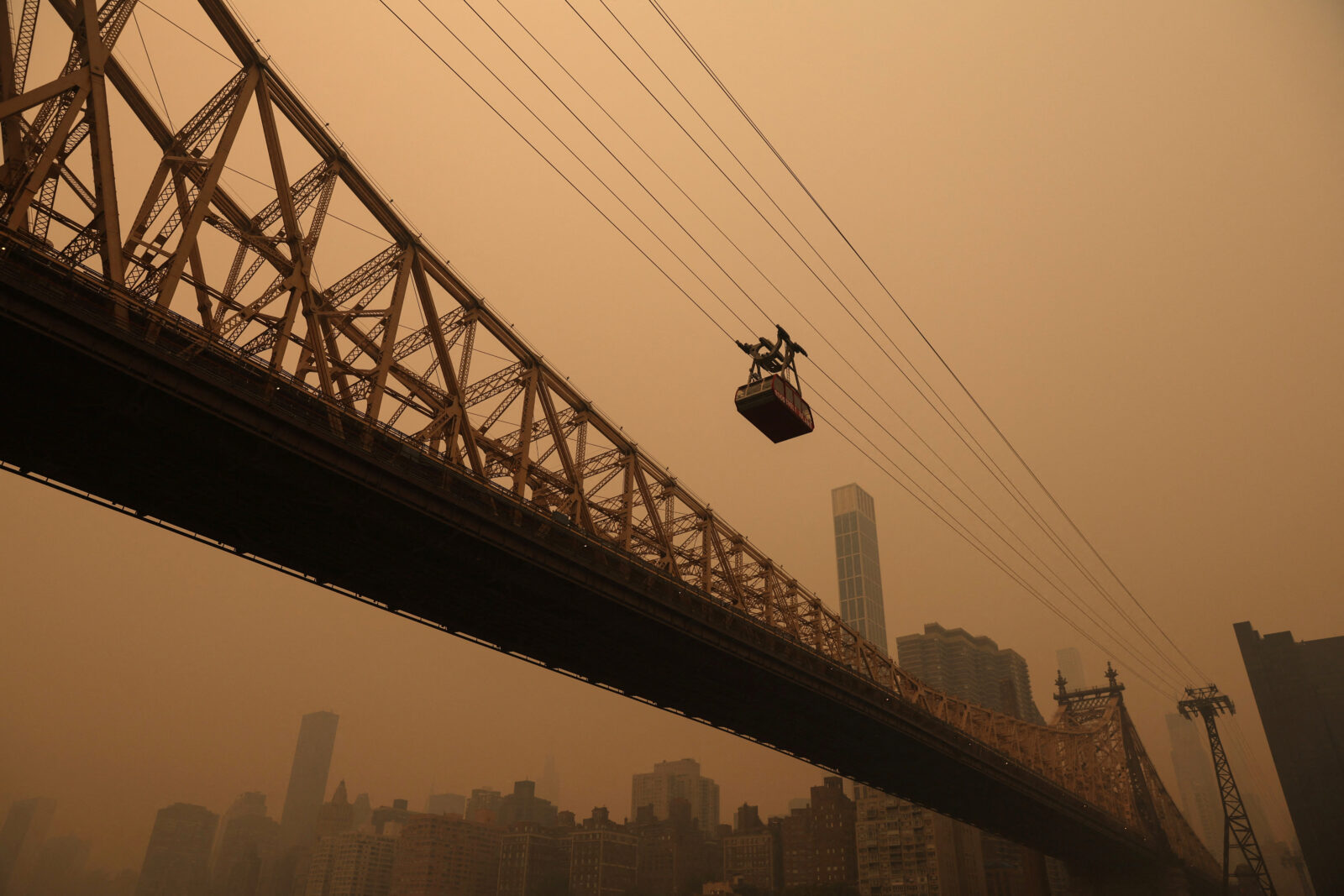 Haze and smoke shroud Manhattan skyline from Canadian wildfires in New York