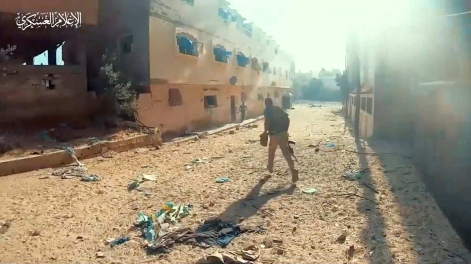 A still image taken from a video released by Hamas shows, what it says are Hamas fighters running with weapons during a battle with Israeli forces amid Israel's ground offensive in a location given as Gaza