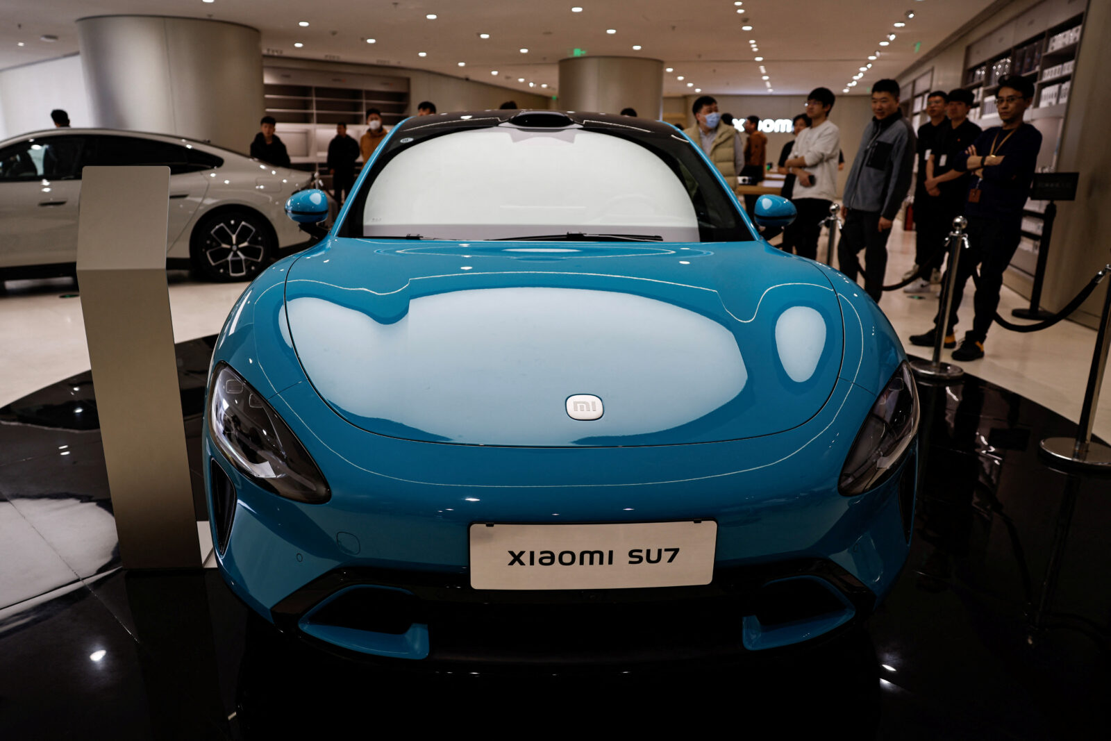 Xiaomi's first electric vehicle SU7 is displayed at a showroom of a newly opened Xiaomi store in Beijing