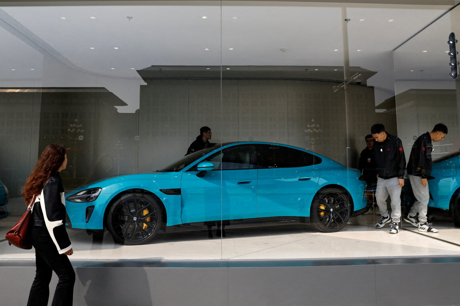 FILE PHOTO: Xiaomi’s first electric vehicle SU7 is displayed at a showroom of a newly opened Xiaomi store in Beijing