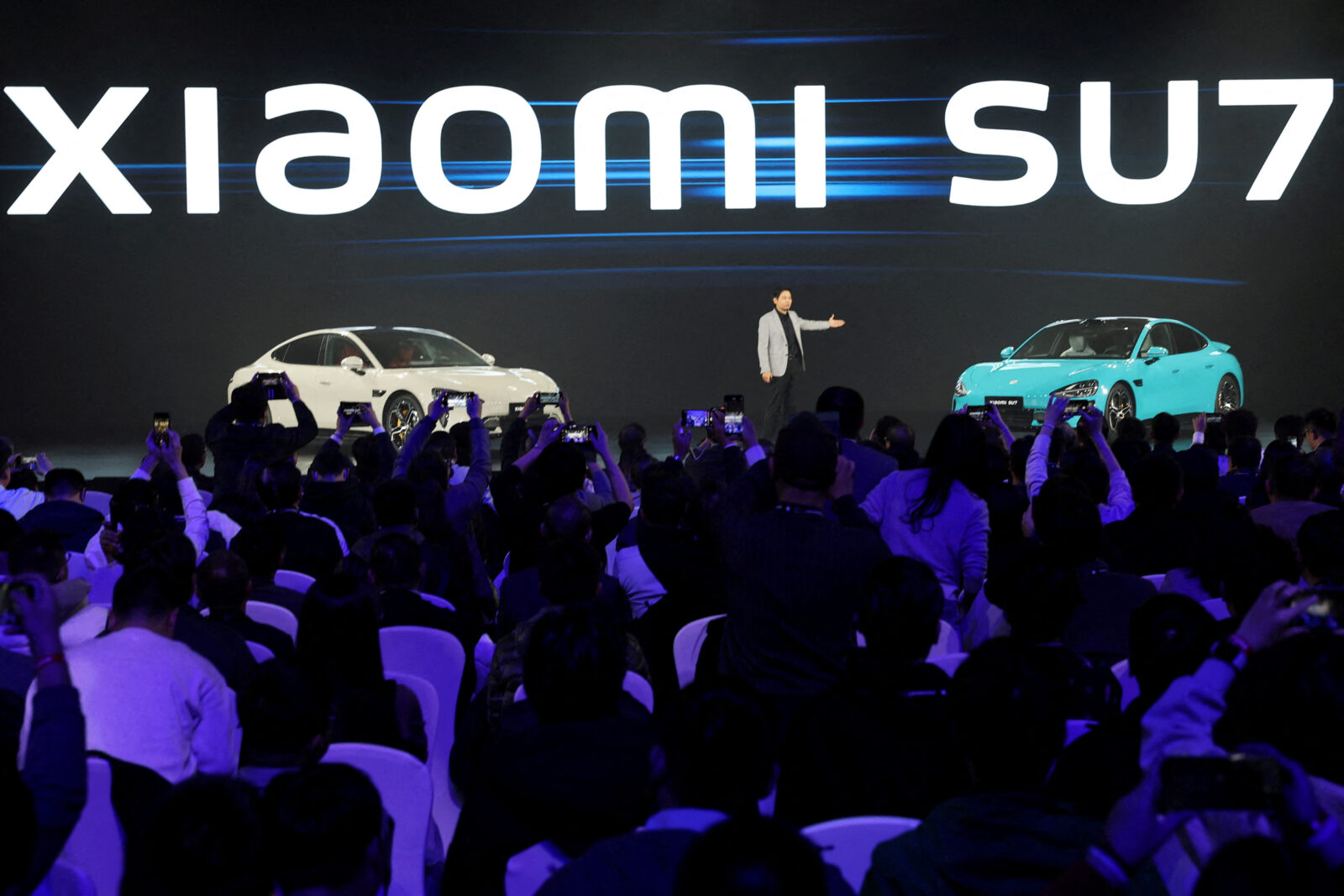 FILE PHOTO: CEO Lei Jun unveils Xiaomi's first electric vehicle, the SU7, in Beijing, China