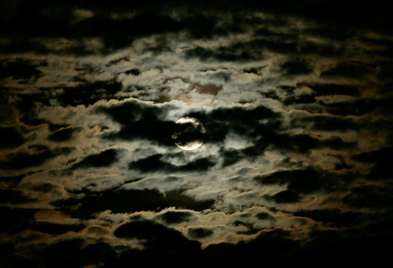 The Supermoon, known as the Hunter's moon, is seen through clouds in Skopje