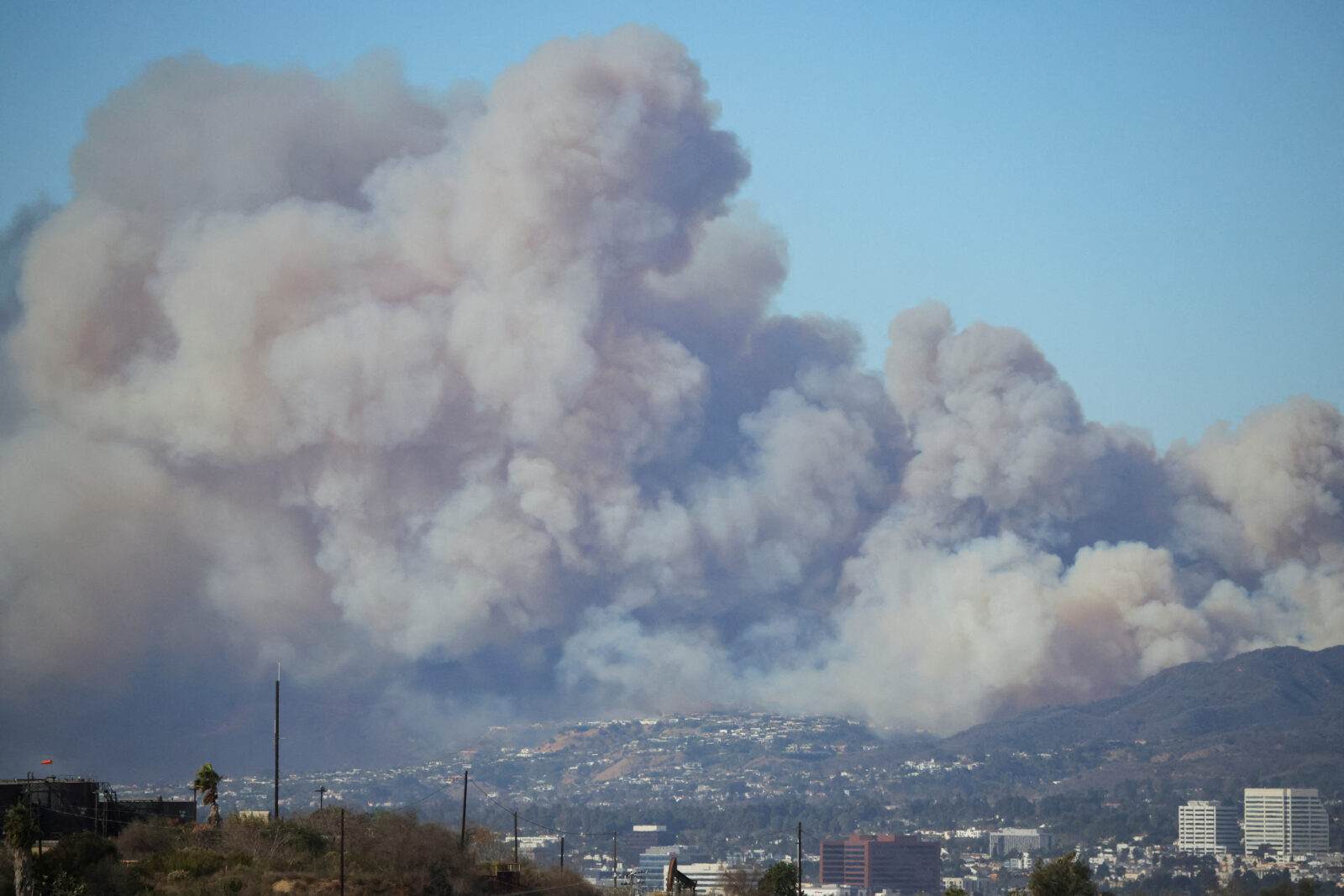 A wildfire burns near Pacific Palisades on the west side of Los Angeles