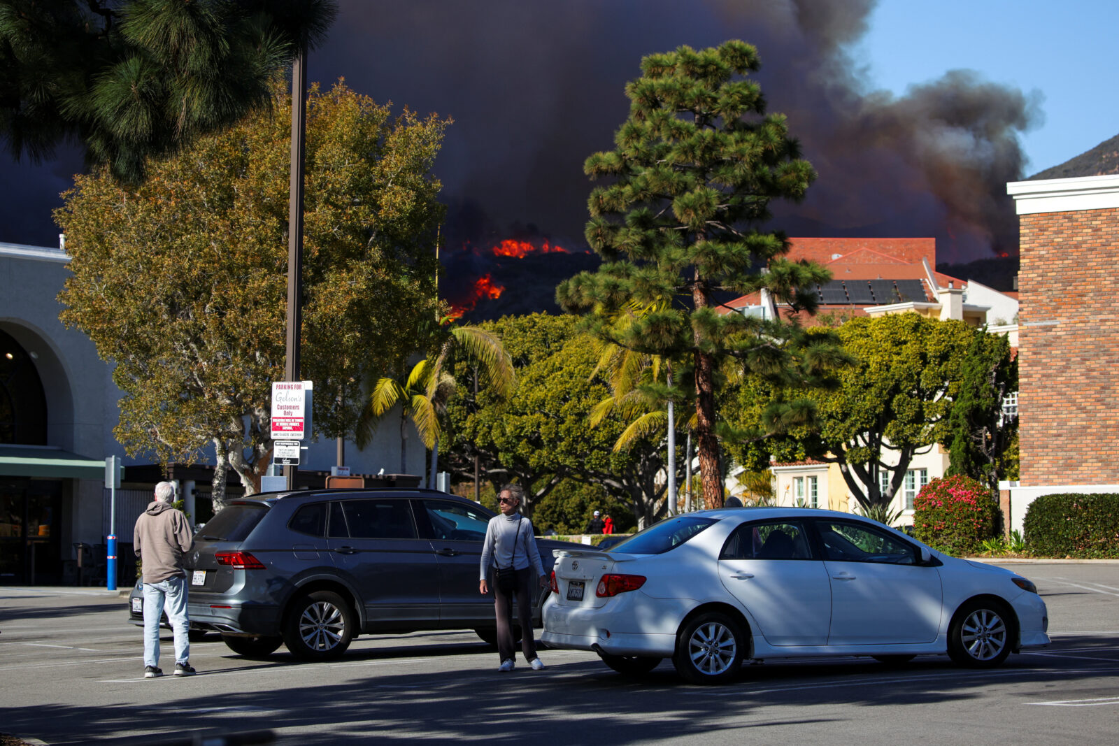 A wildfire burns near Pacific Palisades on the west side of Los Angeles